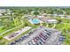Community aerial featuring a pool, clubhouse, parking lot and green space perfect for active lifestyles at 1602 Tally Ho Dr, Lakeland, FL 33810