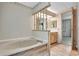 Bathroom featuring a vanity and bathtub at 1602 Tally Ho Dr, Lakeland, FL 33810
