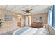 Staged bedroom with carpet, furniture, ceiling fan and decor at 1602 Tally Ho Dr, Lakeland, FL 33810