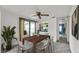 Room with direct access to the lanai, features a decorative ceiling fan, and a mirrored bar area at 1602 Tally Ho Dr, Lakeland, FL 33810