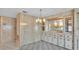 Dining room with wood paneled walls, neutral colored carpet, and decorative lighting at 1602 Tally Ho Dr, Lakeland, FL 33810