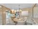Dining area with a wood table, four chairs, and a beautiful view of the backyard at 1602 Tally Ho Dr, Lakeland, FL 33810