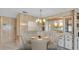 Charming dining room featuring a chandelier, a round table with seating for four, and built-in cabinets at 1602 Tally Ho Dr, Lakeland, FL 33810