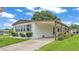 Well-maintained home featuring a covered carport, manicured lawn, and charming curb appeal at 1602 Tally Ho Dr, Lakeland, FL 33810