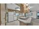 Bright kitchen with a center island, white cabinets, and updated appliances at 1602 Tally Ho Dr, Lakeland, FL 33810