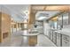 Open kitchen with an island, white cabinets, and updated appliances, perfect for entertaining at 1602 Tally Ho Dr, Lakeland, FL 33810