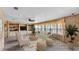 Bright living room with a large window, a comfortable sofa, and built-in shelving for storage at 1602 Tally Ho Dr, Lakeland, FL 33810