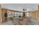 Comfortable living room featuring a neutral color palette, large windows, and stylish furnishings at 1602 Tally Ho Dr, Lakeland, FL 33810