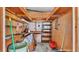 Shed interior with shelving, work bench, an American Flag, and concrete flooring at 1602 Tally Ho Dr, Lakeland, FL 33810