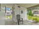 Exterior view of the white storage shed attached to the carport of the home at 1602 Tally Ho Dr, Lakeland, FL 33810