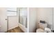 Clean bathroom featuring a shower-tub combination with sliding glass doors and a modern vanity at 1608 Colonnades N Cir, Lakeland, FL 33811