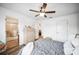 Inviting bedroom with hardwood floors, neutral tones, and ensuite bathroom at 1608 Colonnades N Cir, Lakeland, FL 33811