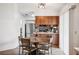 Cozy dining area with wood-look cabinets and stainless steel appliances at 1608 Colonnades N Cir, Lakeland, FL 33811