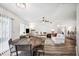 Spacious living room with natural light, hardwood floors, and a cozy seating area at 1608 Colonnades N Cir, Lakeland, FL 33811