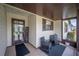 Welcoming screened porch with seating area, creating a cozy and inviting outdoor space at 1608 Colonnades N Cir, Lakeland, FL 33811