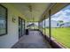 Screened-in porch with a fan and sliding doors at 1608 Colonnades N Cir, Lakeland, FL 33811