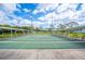 Wide angle view of shuffleboard courts lined in rows, with an overhead shade roof for comfort and benches for onlookers at 1608 Colonnades N Cir, Lakeland, FL 33811