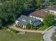 Charming home with well-manicured landscaping, brick driveway, and a serene, private setting at 184 Melissa Trl, Auburndale, FL 33823
