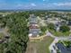 Aerial view of the home highlighting its location in a tree lined neighborhood at 184 Melissa Trl, Auburndale, FL 33823