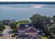Gorgeous lakefront homes with lush trees and landscaping offer serenity and picturesque views at 184 Melissa Trl, Auburndale, FL 33823