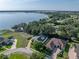Beautiful waterfront home offering scenic views, complemented by lush landscaping and a tranquil environment at 184 Melissa Trl, Auburndale, FL 33823