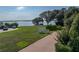 Tranquil backyard with a serene lake view, perfect for relaxation and enjoying nature's beauty at 184 Melissa Trl, Auburndale, FL 33823