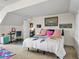 Bright bedroom with colorful accents features comfortable furnishings, decorative art, and ample natural light at 184 Melissa Trl, Auburndale, FL 33823