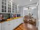 Butlers pantry featuring counter space and glass cabinets at 184 Melissa Trl, Auburndale, FL 33823