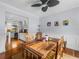 Inviting dining area with rustic wooden table and view to the kitchen at 184 Melissa Trl, Auburndale, FL 33823