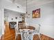 Dining area with gorgeous wood floors, bright white walls, and access to other living areas at 184 Melissa Trl, Auburndale, FL 33823