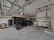 Spacious garage featuring storage and a dark colored SUV at 184 Melissa Trl, Auburndale, FL 33823