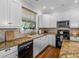 Kitchen featuring stone countertops, stainless appliances and dark cabinetry at 184 Melissa Trl, Auburndale, FL 33823