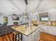 Open-concept kitchen and Gathering room, with an island and granite countertops at 184 Melissa Trl, Auburndale, FL 33823