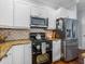 Updated kitchen features stainless steel appliances, granite countertops and beautiful cabinets at 184 Melissa Trl, Auburndale, FL 33823