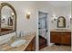 A view of the main bathroom featuring granite countertops, tiled floors and double sinks at 184 Melissa Trl, Auburndale, FL 33823