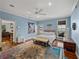 Bright main bedroom features water views, a colorful rug, and access to a sitting area at 184 Melissa Trl, Auburndale, FL 33823