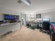 Bright office space with multiple computer monitors and ample desk space is ideal for remote work at 184 Melissa Trl, Auburndale, FL 33823
