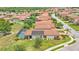 Aerial view of a home with solar panels and screened pool in a residential neighborhood at 1902 Altavista Cir, Lakeland, FL 33810