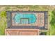 Overhead aerial view of caged pool, spa, brick patio, and roof at 1902 Altavista Cir, Lakeland, FL 33810