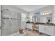 Modern bathroom with a large walk-in shower, double sinks, and a vanity area with ample natural light at 1902 Altavista Cir, Lakeland, FL 33810