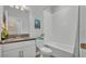 Bright bathroom with granite vanity top and combined bath tub and shower at 1902 Altavista Cir, Lakeland, FL 33810