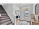 Welcoming foyer featuring a staircase and access to an office at 1902 Altavista Cir, Lakeland, FL 33810