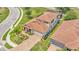 Aerial view of a two-story home featuring a brick driveway and landscaped front yard at 1902 Altavista Cir, Lakeland, FL 33810