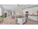 Spacious kitchen open to the living area, featuring an island with bar seating and modern finishes at 1902 Altavista Cir, Lakeland, FL 33810