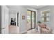 Bright sitting area with comfortable chair and view to patio with sliding glass doors at 1902 Altavista Cir, Lakeland, FL 33810