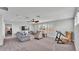 Upstairs living room with comfortable seating, a ceiling fan and windows that provide natural light at 1902 Altavista Cir, Lakeland, FL 33810