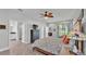Spacious primary bedroom with hardwood floors, a ceiling fan, and access to an outdoor patio at 1902 Altavista Cir, Lakeland, FL 33810