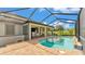Beautiful pool and spa area with brick patio and full screened-in enclosure at 1902 Altavista Cir, Lakeland, FL 33810