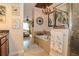 Well-lit bathroom with soaker tub, glass shower, and view into the bedroom at 1970 Michael Tiago Cir, Maitland, FL 32751