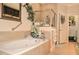 Luxurious bathroom featuring a soaking tub, separate shower, and elegant finishes, creating a spa-like retreat at 1970 Michael Tiago Cir, Maitland, FL 32751